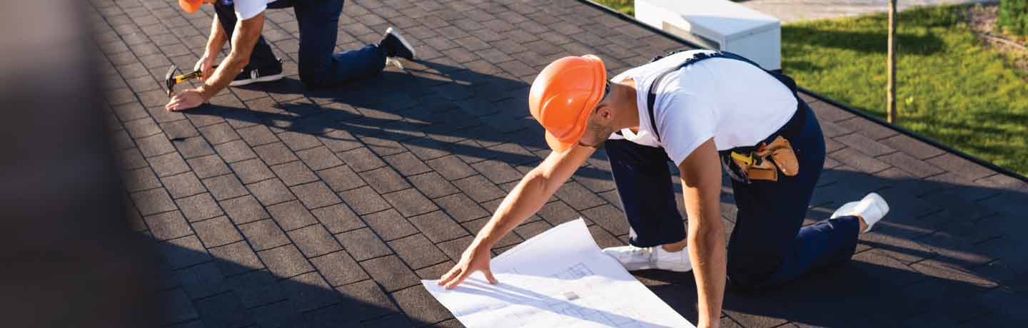 Contractor working on roof.