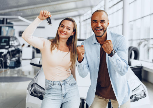 Happy couple buying a car