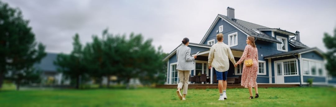Young couple being given a house tour